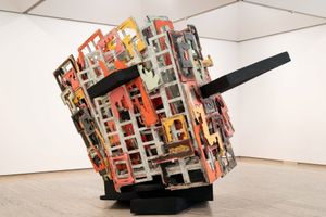 Phyllida Barlow, _untitled: brokenupturnedhouse_ (2013). Steel armature, polystyrene, polyfiller, papier-mâché, paint, PVA, sand, plywood, timber, varnish. 360 x 480 x 330 cm. Exhibition view: _Dreamhome: Stories of Art and Shelter_, Art Gallery of New South Wales, Sydney (3 December 2022–late-2023). © Phyllida Barlow. Courtesy Geoff Ainsworth AM and Johanna Featherstone, 2017\.